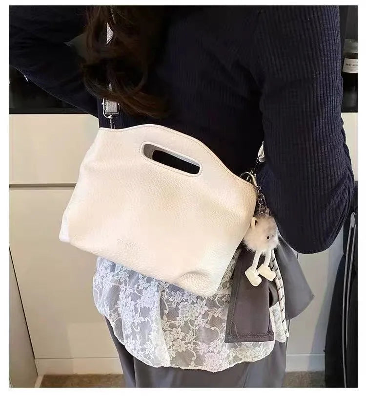 American retro vegan leather crossbody bag in white — front view of bag showing soft faux leather and adjustable strap