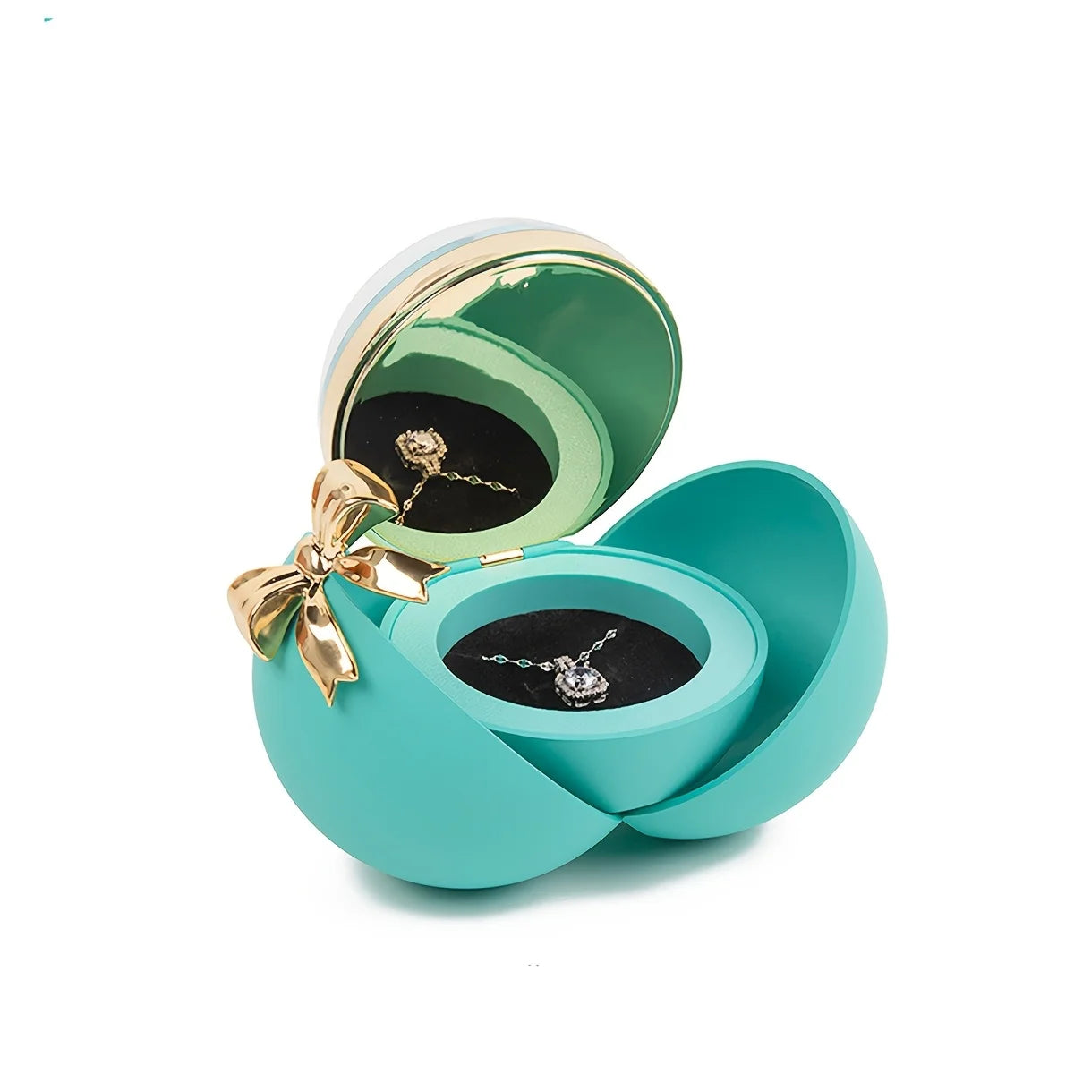 Blue ball-style jewellery box open with a necklace displayed in the dome and a reflection of the necklace showing in the lid mirror