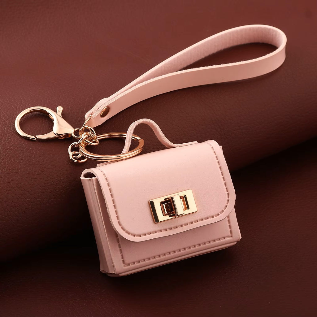 Pink kawaii mini bag charm keychain with gold lobster clasp and wrist strap — Korean cute faux leather bag pendant