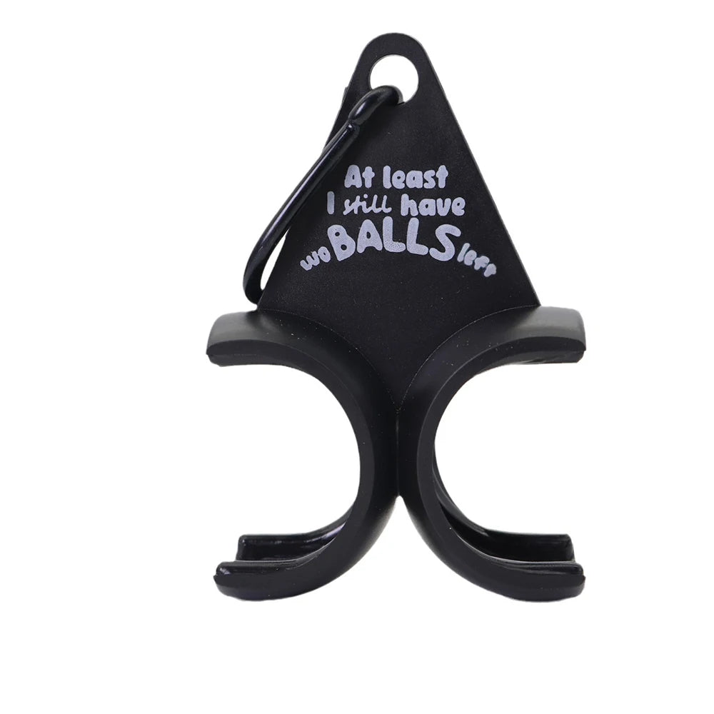 Novelty golf ball holder front view showing carabiner clip and "At least I still have two BALLS left" moulded lettering