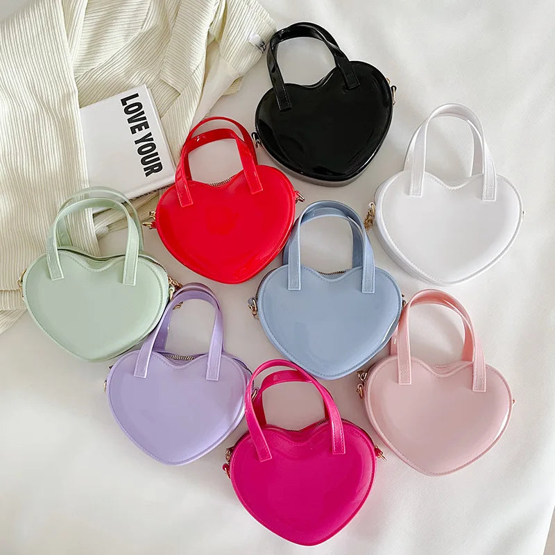 Heart-shaped mini handbags in all eight colours arranged together