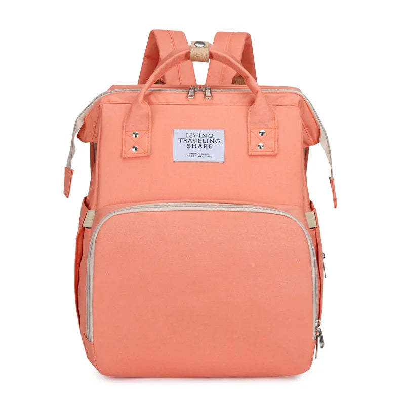 Pink: 2-in-1 nappy bag backpack in pink, front view