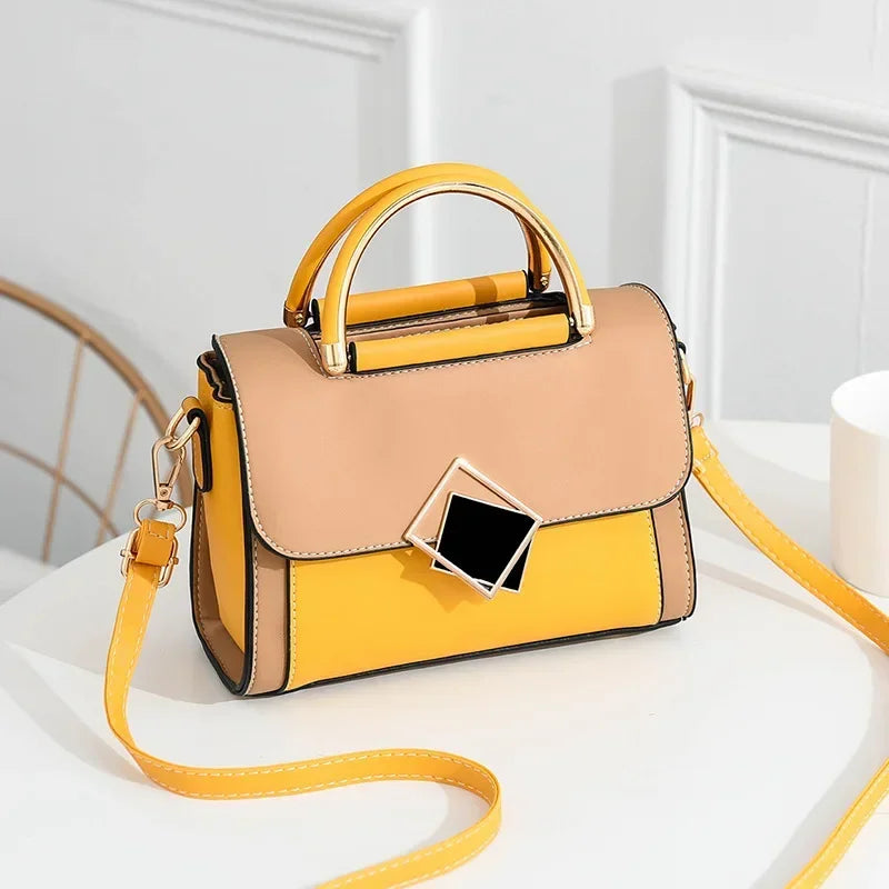 Yellow colour block PU leather shoulder bag with gold metal top handle and adjustable crossbody strap