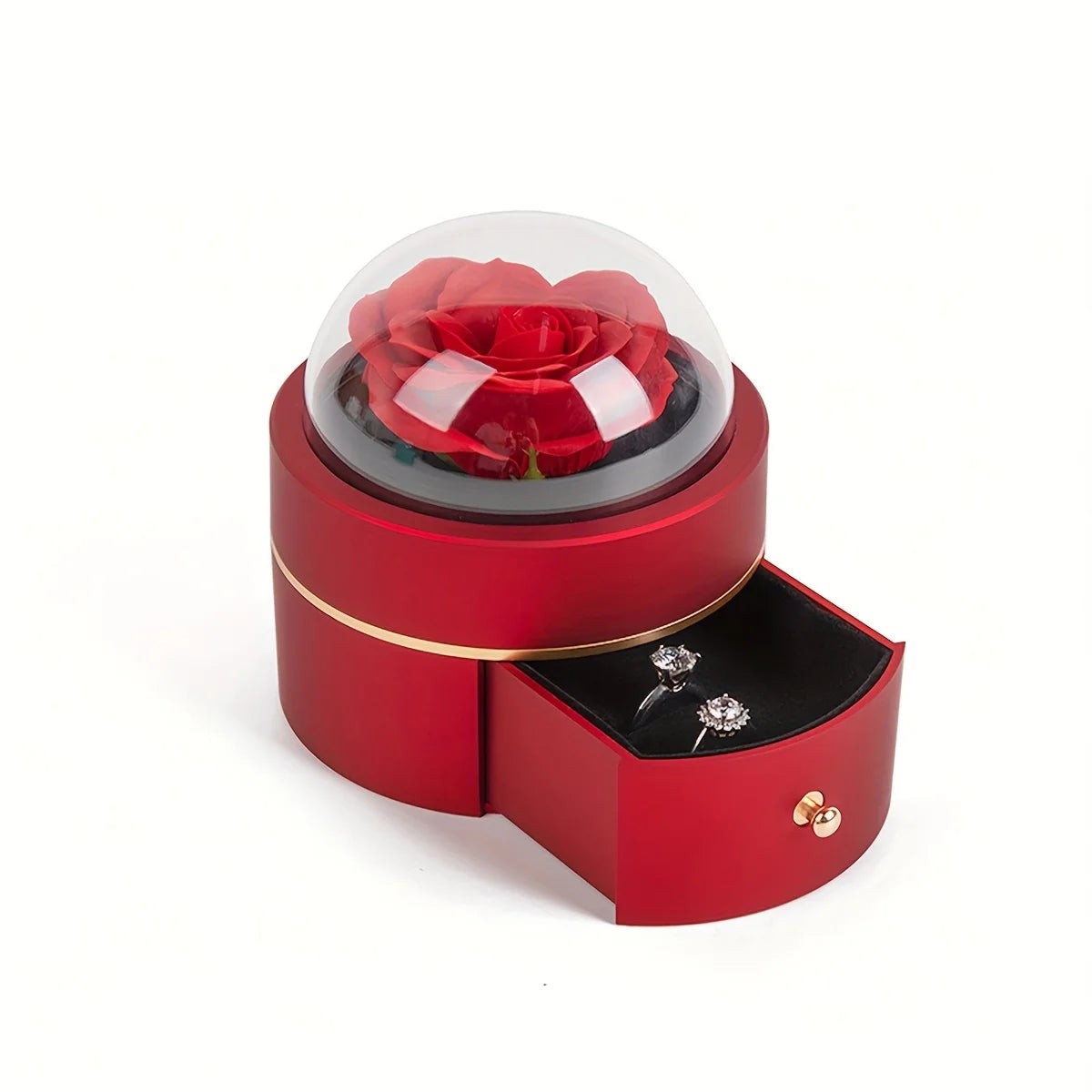 Red round rose jewellery box with an artificial rose under a clear dome and the drawer open showing a ring and earrings