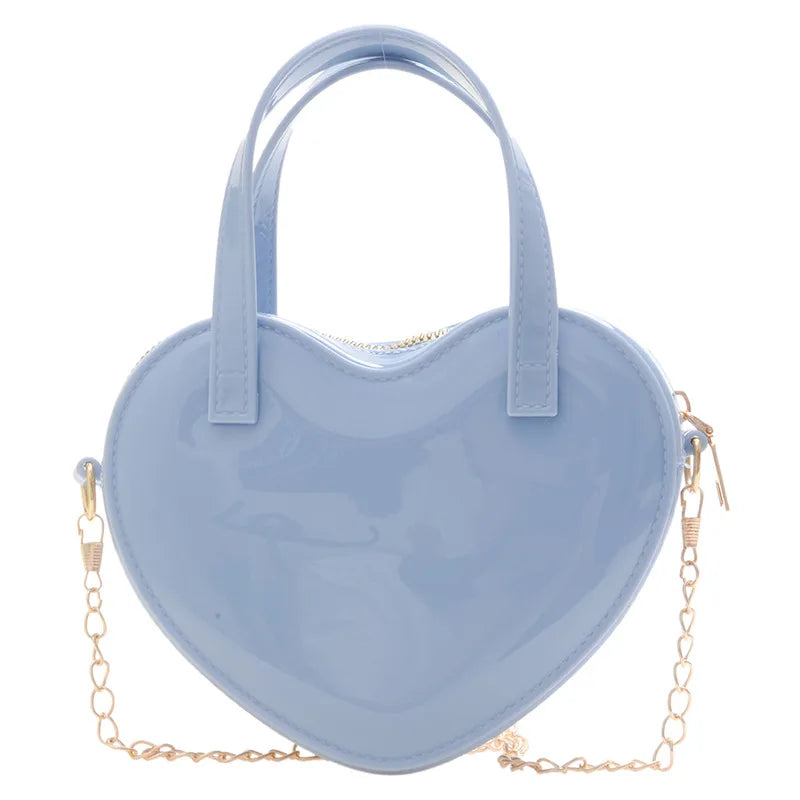 Blue heart-shaped handbag front view with twin handles and gold chain strap