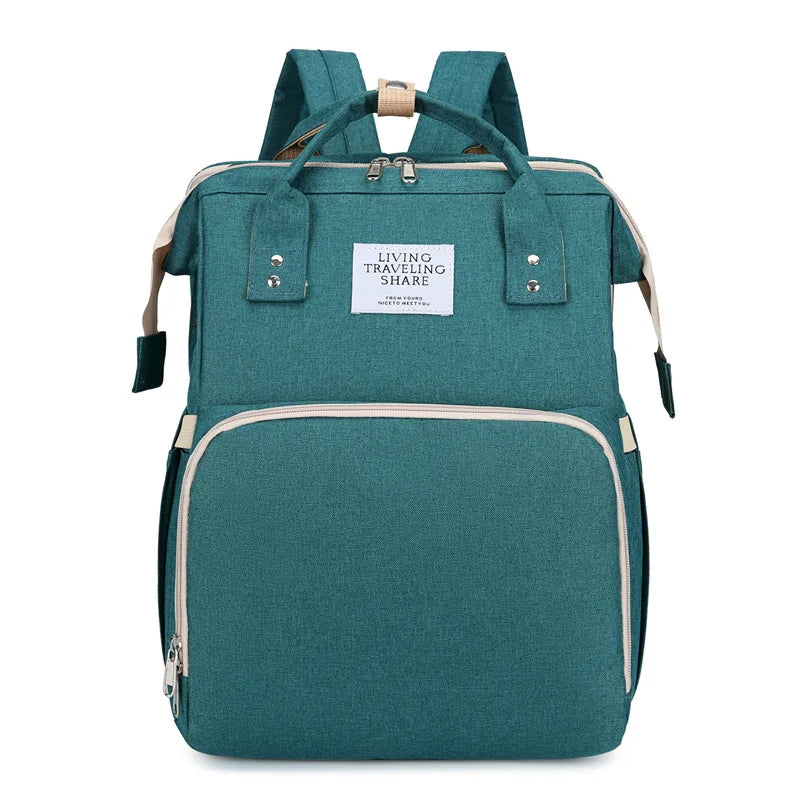 Green: 2-in-1 nappy bag backpack in green, front view