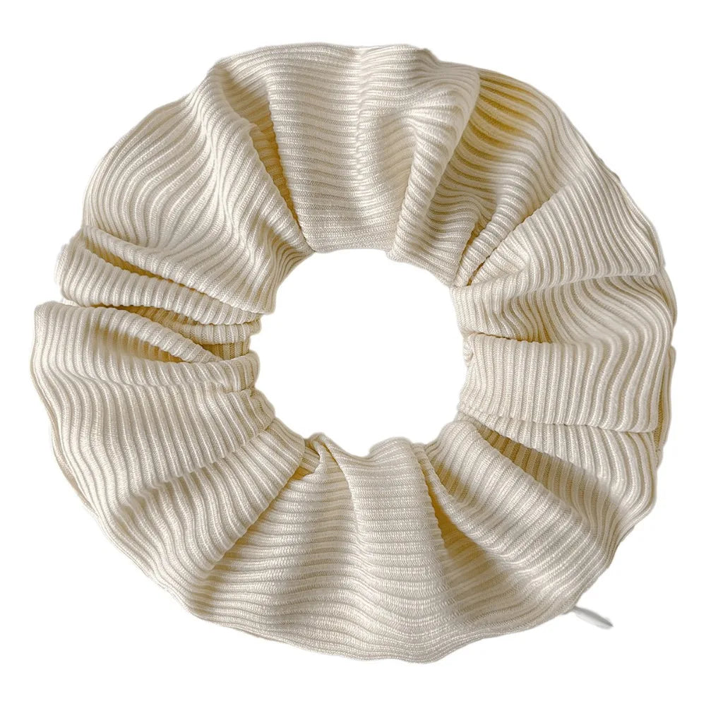Hidden closure hair scrunchie in cream ribbed knit with zipper storage pocket