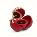 Red ball-style jewellery box open with a red-stone ring in the dome and a reflection of ring showing in the lid mirror