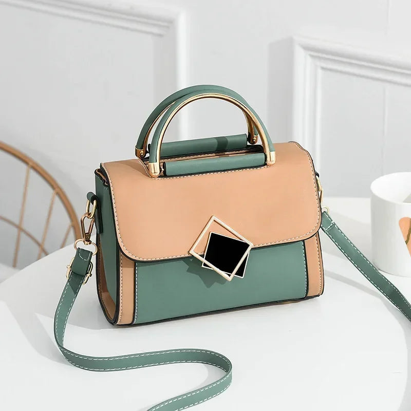 Green colour block PU leather shoulder bag with gold metal top handle and adjustable crossbody strap