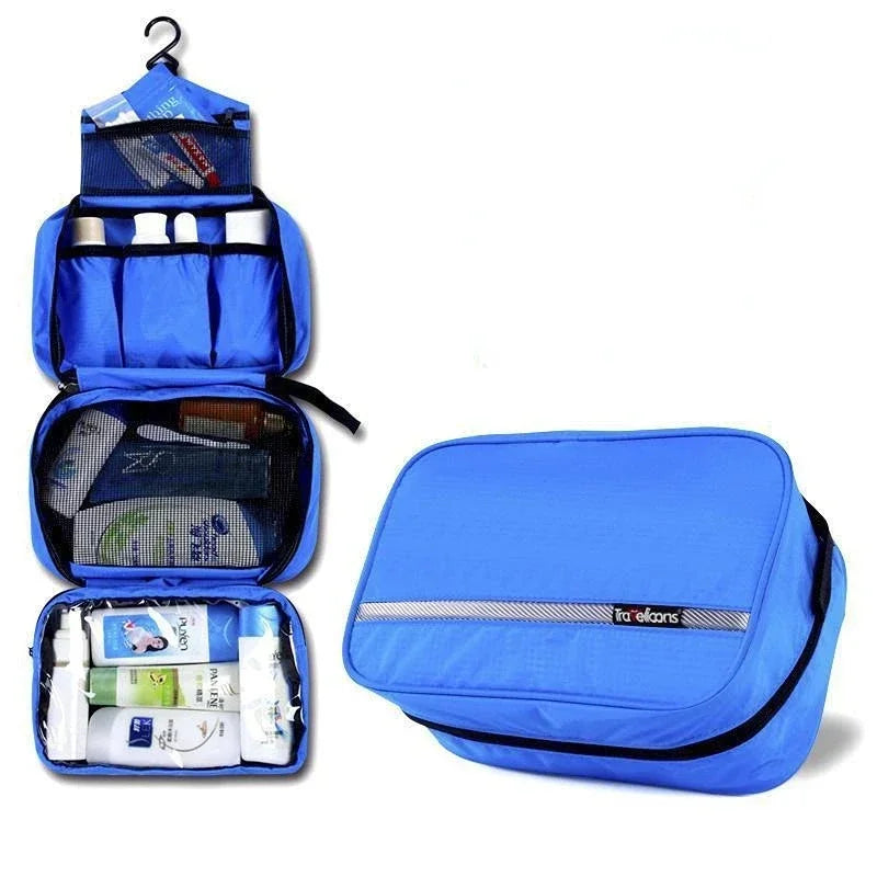 Blue hanging toiletry bag unrolled with toiletries next to the zipped closed bag