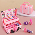 Pink princess makeup suitcase open with cosmetics displayed around it
