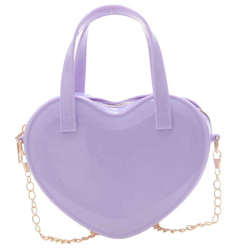 Purple heart-shaped handbag front view with twin handles and gold chain strap