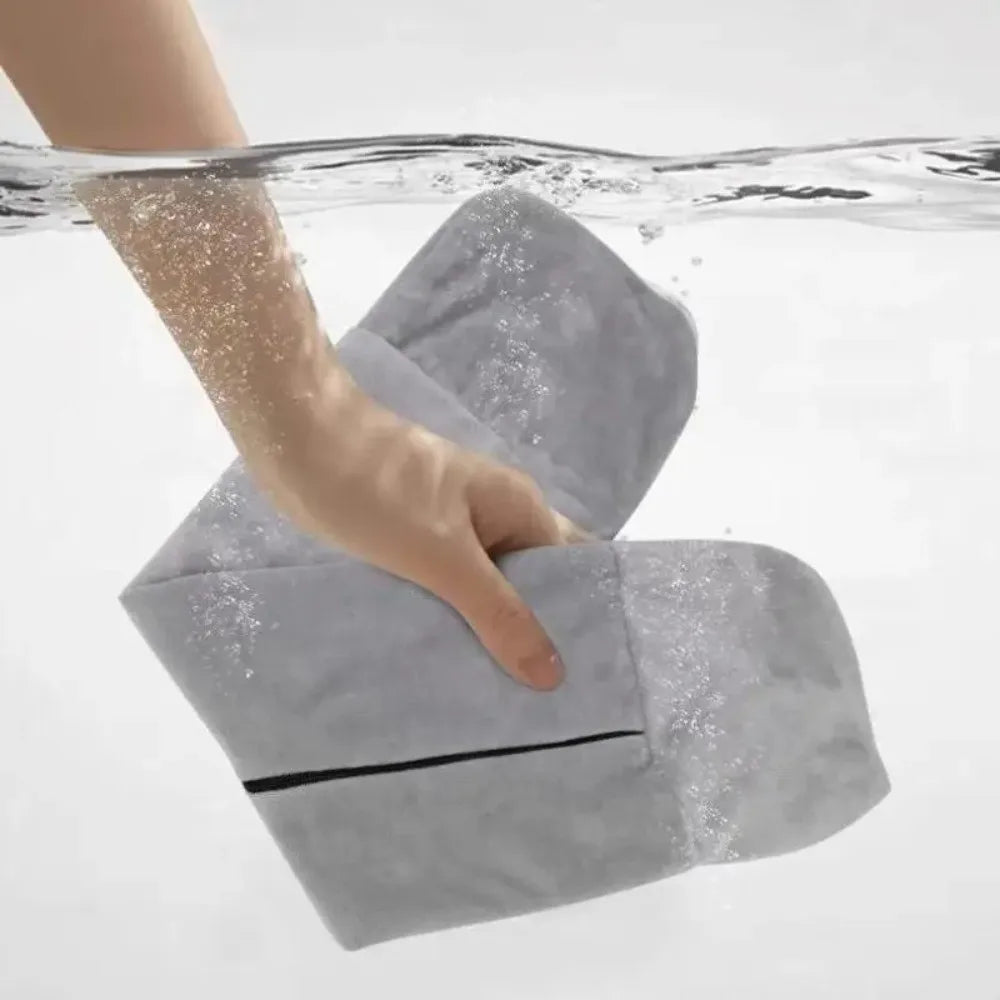 Grey pillow submerged in water
