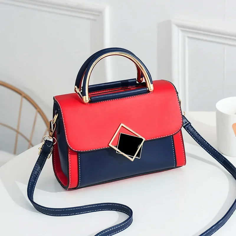 Blue colour block PU leather shoulder bag with gold metal top handle and adjustable crossbody strap