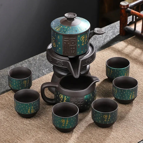 MiniSolutions Teal Fortune 8-piece Kung Fu tea set with dark clay automatic teapot and 6 teal and gold Chinese character teacups on bamboo mat