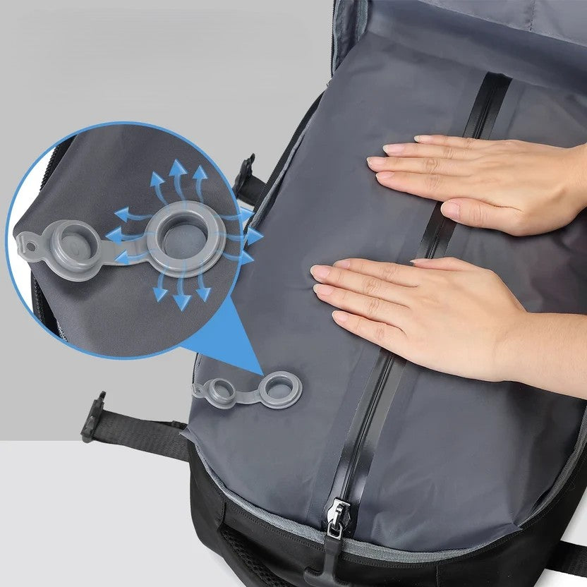 Close-up of compression travel backpack one-way exhaust valve — press to compress air out for compact packing