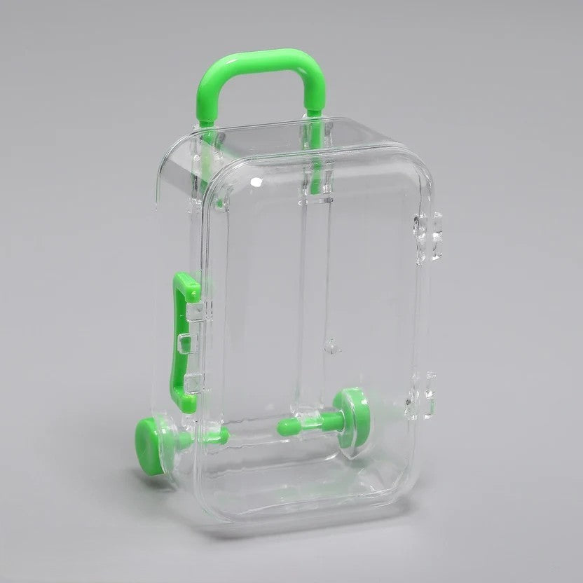 Transparent acrylic mini suitcase display box with green color-matched handle, wheels, and latch