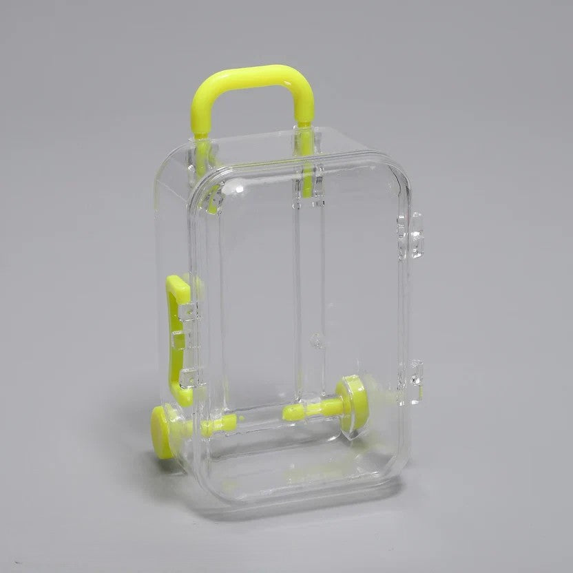 Transparent acrylic mini suitcase display box with yellow color-matched handle, wheels, and latch