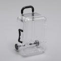 Transparent acrylic mini suitcase display box with black color-matched handle, wheels, and latch
