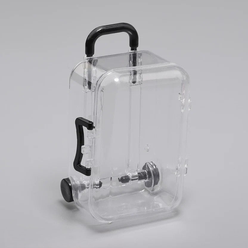 Transparent acrylic mini suitcase display box with black color-matched handle, wheels, and latch
