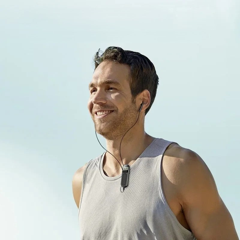 Man listening to mini portable FM radio clipped on while running outdoors — lightweight 90g pocket radio for travel and outdoor use