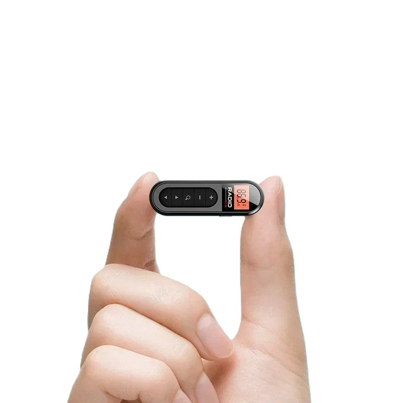 Mini portable FM radio in hand